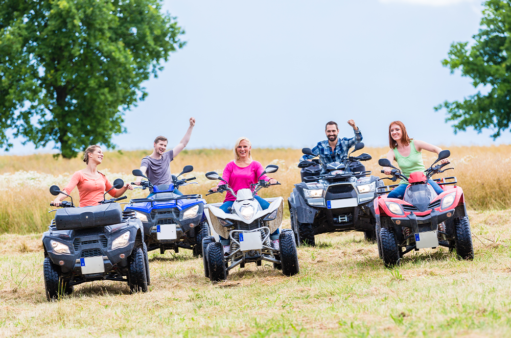 People riding ATV's